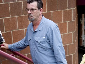 In this July 26, 2016 photo, Kevin Lee Ewing, left, leaves with one of his attorneys after a preliminary hearing with District Judge Jay Weller in Canonsburg, Pa. Ewing's case will go to court on charges including kidnapping and aggravated assault. Ewing, free on bond while awaiting trial on charges he abducted and beat his wife while holding her captive for nearly two weeks earlier this summer, kidnapped her again Tuesday, Aug. 30, 2016, and is on the run, state police said. (Katie Roupe /Observer-Reporter via AP)