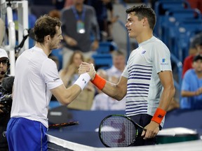 Andy Murray of Great Britain and Milos Raonic of Canada shake hands after Murray won their semifinal match at the Western & Southern Open in Mason, Ohio, on Aug. 20, 2016. (Andy Lyons/Getty Images)