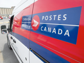 A Canada Post truck is parked at a sorting centre in Montreal, Friday, July 8, 2016 (Ryan Remoirz, The Canadian Press)