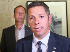 Mayor Brian Bowman (right) and councillor John Orlikow speak with the media during a scrum Tuesday August 30, 2016.