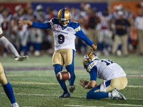 Winnipeg Blue Bombers kicker Justin Medlock kicks a field goal as they face the Montreal Alouettes during fourth quarter CFL football action Friday, August 26, 2016 in Montreal. THE CANADIAN PRESS/Paul Chiasson