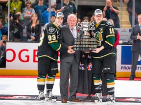 Co-captains Mitch Marner (left) and Christian Dvorak of the London Knights are presented the Memorial Cup by President of the CHL and OHL Commissioner David Branch at the 2016 MasterCard Memorial Cup in Red Deer, Alta. on Sunday, May 29, 2016.  (Rob Wallator / CHL Images)
