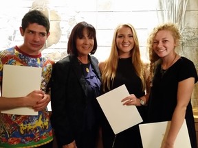 Rossana Magnotta, CEO of Magnotta Winery, second from left, with the winners of the company’s student art competition — Michael Carrozza, left, Kelly Baskin and Olivia Brouwer.