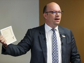 University of Alberta’s Dr. Kristopher Wells, Assistant Professor, Department of Educational Policy Studies, speaks at a Public Interest Alberta media conference about Making the Grade, an analysis of four sexual orientation and gender identity policies that school boards have submitted to Alberta Education in Edmonton, Alberta on Tuesday, August 30, 2016. He's holding a report card for Red Deer Public Schools, which received an A+.