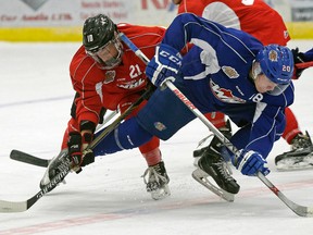 Branden Klatt (right) is checked by Brandon Rowley (right) during an Edmonton Oil Kings training camp scrimmage game at the Dow Centennial Centre in Fort Saskatchewan, Alberta on Monday August 29, 2016.