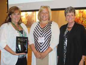 Supplied photo
Roxanne Zuck (left) and Kathryn Irwin-Seguin (right) of Monarch Recovery Services accepted the community impact award from Timelined Consulting Inc. Jennifer Michaud of the North East Local Health Integration Network also attended. Timelined has been renamed PACE (Partners in Achieving Change Excellence).