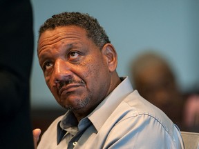 Darryl Howard listens as one of his attorneys speaks during a hearing Tuesday, Aug. 30, 2016, at the Durham County Courthouse in Durham, N.C. Jermeck Jones, an ex-convict linked to a slain woman through DNA testing, is refusing to answer questions at a hearing that could free Howard, who was sentenced to prison 21 years ago for the killing. (Kaitlin McKeown/The Herald-Sun via AP)