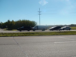 Manitoba's independent investigation unit investigate a scene just north of Winnipeg on Highway 59 near Highway 44 on Sept. 21, 2015. Winnipeg police officers shot and killed a 44-year-old man at the scene. (JIM BENDER/WINNIPEG SUN FILE PHOTO)