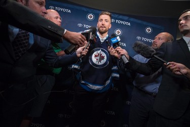 Winnipeg Jets' new captain Blake Wheeler speaks to the media during a press conference in Winnipeg on Wednesday, August 31, 2016. THE CANADIAN PRESS/David Lipnowski