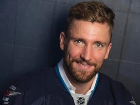 Winnipeg Jets' new captain Blake Wheeler poses for a portrait following a press conference in Winnipeg on Wednesday, August 31, 2016. THE CANADIAN PRESS/David Lipnowski