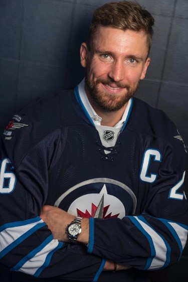 Winnipeg Jets' new captain Blake Wheeler poses for a portrait following a press conference in Winnipeg on Wednesday, August 31, 2016. THE CANADIAN PRESS/David Lipnowski
