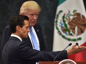 US presidential candidate Donald Trump (R) and Mexican President Enrique Pena Nieto prepare to deliver a joint press conference in Mexico City on August 31, 2016. Donald Trump was expected in Mexico Wednesday to meet its president, in a move aimed at showing that despite the Republican White House hopeful's hardline opposition to illegal immigration he is no close-minded xenophobe. Trump stunned the political establishment when he announced late Tuesday that he was making the surprise trip south of the border to meet with President Enrique Pena Nieto, a sharp Trump critic. (AFP PHOTO/YURI CORTEZYURI CORTEZ/AFP/Getty Images)