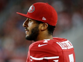 San Francisco 49ers quarterback Colin Kaepernick watches from the sideline during the second half of an NFL preseason football game against the San Diego Chargers in Santa Clara, Calif. (AP Photo/Tony Avelar, File)