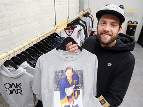 Chris Watchorn, owner of Oak + Oar, displays a Blake Wheeler t-shirt in his shop in Winnipeg, Man. Wednesday August 31, 2016.