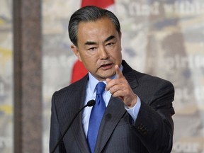 China's Minister of Foreign Affairs Wang Yi responds to a Canadian journalist's question during a press conference with Canadian Minister of Foreign Affairs Stephane Dion (not shown) on Wednesday, June 1, 2016 in Ottawa. THE CANADIAN PRESS/Justin Tang