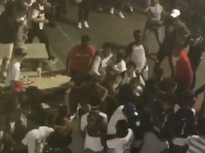 Brawl at the CNE on Tuesday, Aug. 30, 2016 shut the Ex down early. (Screengrab from @AliBinesh video)