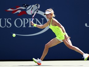 Eugenie Bouchard of Canada returns a shot to Katerina Siniakova of the Czech Republic during a U.S. Open match at the USTA Billie Jean King National Tennis Center on Aug. 30, 2016. (Al Bello/Getty Images)