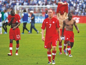 A shell-shocked Iain Hume walks off the pitch following Canada’s 8-1 loss to Honduras in a World Cup qualifier at San Pedro Sula on Oct 16, 2012. (AP)