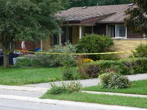 Police investigate the scene of a house fire that killed 21-year-old Ryan Parsons and sent a 19-year-old women to hospital in critical condition in Dorchester, Ont., on Aug. 31, 2016. (MORRIS LAMONT/The London Free Press/Postmedia Network)