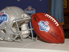 The 2017 NFL Draft helmet and football are shown on display during the press conference announcing that the 2017 NFL Draft will be held in Philadelphia, Thursday, Sept. 1, 2016, in Philadelphia. (AP Photo/Chris Szagola)