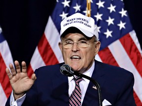 Former mayor of New York CIty Rudy Giuliani, wears a "Make Mexico Great Again Also" hat prior to Republican presidential candidate Donald Trump's speech during a campaign rally at the Phoenix Convention Center, Wednesday, Aug. 31, 2016, in Phoenix. (AP Photo/Matt York)
