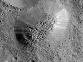 This image provided by NASA, shows an inactive volcano on the surface of Ceres, the largest object in the asteroid belt between Mars and Jupiter. Scientists said the volcano on the dwarf planet Ceres is about half as tall as Mount Everest. (NASA/JPL-Caltech/UCLA/MPS/DLR/IDA via AP)