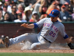 Neil Walker of the New York Mets slides home during MLB play against the San Francisco Giants at AT&T Park on August 20, 2016. (Thearon W. Henderson/Getty Images)