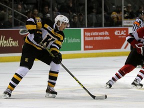 Kingston Frontenacs forward Jason Robertson carries the puck past Ottawa 67's defenceman Stepan Falkovsky during Ontario Hockey League action at the Rogers K-Rock Centre Nov. 25, 2015. (Steph Crosier/Whig-Standard file photo)