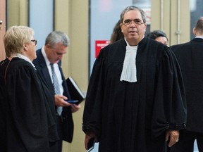 Lawyer for Richard Bain, Alan Guttman, right, waits outside the courtroom at the Montreal Courthouse, Friday, August 12, 2016, prior to the judge's instructions to the jury in the Bain trial. THE CANADIAN PRESS/Graham Hughes