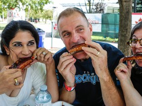 The Toronto Sun's Adrienne Batra, from left, Rita DeMontis and Ted Rath help judge Rib Fest at the CNE Thursday, September 1, 2016. (Dave Thomas/Toronto Sun)