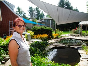 Barbara Drake, the owner/operator of Ray Catchers, shows two sun sails at her London home. (MIKE HENSEN, The London Free Press)