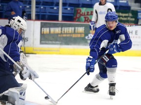 Sudbury Wolves hopeful Kyle Liinama takes a shot on goalie Zack Bowman during traning camp in Sudbury, Ont. on Thursday September 1, 2016. Gino Donato/Sudbury Star/Postmedia Network