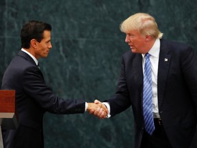 Mexico President Enrique Pena Nieto and Republican presidential nominee Donald Trump shake hands after a joint statement at Los Pinos, the presidential official residence, in Mexico City, Wednesday, Aug. 31, 2016. Trump is calling his surprise visit to Mexico City Wednesday a 'great honor.' The Republican presidential nominee said after meeting with Pena Nieto that the pair had a substantive, direct and constructive exchange of ideas.(AP Photo/Dario Lopez-Mills)