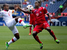 Julian de Guzman of Canada battles for the ball with Richard Dixon of Panama during the first half of a CONCACAF Gold Cup match at Sports Authority Field at Mile High on July 14, 2013. (Justin Edmonds/Getty Images)