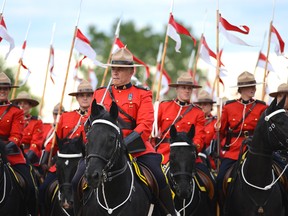 Members of RCMP Musical Ride gets ready for the Sunset ceremony at RCMP Musical Ride Stables on Wednesday, June 22, 2016. The Musical Ride is set to perform Sept. 14 in Alvinston.
File photo/Postmedia