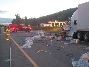 Submitted photo
Two transport trucks collided on Highway 401’s westbound lanes Thursday evening. The crash resulted in charges against both drivers and a passenger in one of the trucks suffered minor injuries.