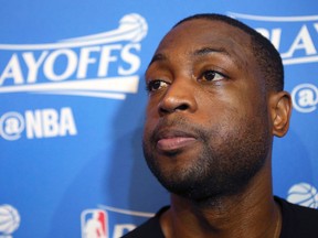 In this April 28, 2016, file photo, then-Miami Heat guard Dwyane Wade, speaks with the media after basketball practice in Miami. Wade has lashed out against his hometown of Chicago's gun laws, calling them weak and saying he's already urged city officials to enact changes to help both citizens and police. Wade spoke out to ABC News in an interview that aired Friday, one day before the funeral for his cousin Nykea Aldridge — a mother of four who was shot and killed on a Chicago street last week. (David Santiago/El Nuevo Herald via AP, File)