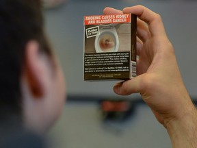 High school students look at plain cigarette packaging examples on May 31, 2016. The federal government wrapped up a public consultation on the implementation of plain packaging for cigarettes on Aug. 31.(THE CANADIAN PRESS)
Sean Kilpatrick