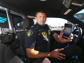 OPP Sgt. Kerry Schmidt wants drivers to put their phones away. (Jack Boland/Toronto Sun)