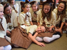 Rebound’s Act II program presents A Little Princess, Sept. 8-10 at the Imperial Theatre. Pictured in centre, second from the right is Talia Mielke, who plays the lead role of Sarah Crewe. She is seen telling a story to her school mates, while comforting young Lottie, played by Sarah Hay. Handout/Sarnia Observer/Postmedia Network
