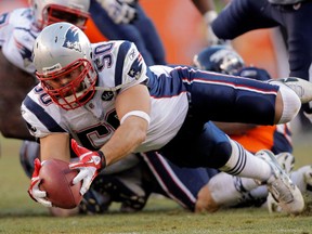 Rob Ninkovich of the New England Patriots recovers the ball against the Denver Broncos at Sports Authority Field at Mile High on December 18, 2011 in Denver. (Justin Edmonds/Getty Images)