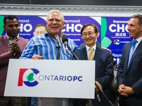Raymond Cho is congratulated by Doug Ford and Ontario PC Leader Patrick Brown after his byelection win in Scarborough-Rouge River. (Ernest Doroszuk/Toronto Sun/Postmedia Network)