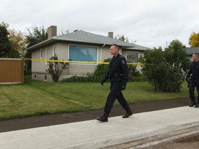 Edmonton Police Service officers have found two bodies in a home at 11145 111 Avenue in Edmonton, Alberta on Friday, September 2, 2016. Police say a suspect has been arrested. Ian Kucerak / Postmedia
