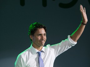 Canadian Prime Minister Justin Trudeau waves to the audience after speaking at a promotional event for Canadian company Manulife, Friday September 2, 2016 in Shanghai, China. THE CANADIAN PRESS/Adrian Wyld