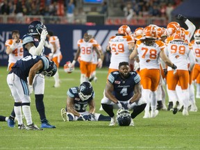 Toronto Argonauts players react as the B.C. Lions celebrate in Toronto, on Wednesday, August 31, 2016. (THE CANADIAN PRESS/ Chris Young)