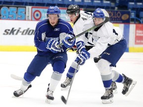 Sudbury Wolves Ben Garagan and Shane Bulitka battle for the puck during a scrimmage  during Sudbury Wolves training camp in Sudbury, Ont. on Thursday September 1, 2016. Gino Donato/Sudbury Star/Postmedia Network