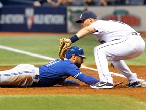 Kevin Pillar of the Toronto Blue Jays dives back to first base before Brad Miller of the Tampa Bay Rays can make the tag at Tropicana Field on September 2, 2016 in St. Petersburg, Fla. (Joseph Garnett Jr./Getty Images)