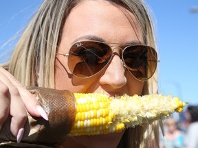 Vegetarian Brianne Beaulieu enjoys a corn on the cob at  Downtown Sudbury Ribfest on Friday September 2, 2016 .Downtown Sudbury Rib Fest  runs Saturday 11 am to 10 pm  and Sunday from 11 am to 6 pm. Gino Donato/Sudbury Star/Postmedia Network