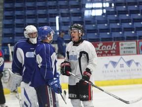 Sudbury Wolves hopeful Drake Pilon gets in the face of an opposition player while goaltender Zack Bowman looks on during the annual Blue and White Gajme on Saturday morning at Sudbury Community Arena. Bruce Heidman/The Sudbury Star