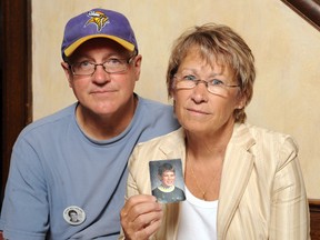 In this Aug. 28, 2009, file photo, Patty and Jerry Wetterling show a photo of their son Jacob Wetterling, who was abducted in October of 1989 in St. Joseph, Minn and is still missing, in Minneapolis. Patty Wetterling said Saturday, Sept. 3, 2016 that his remains have been found. Daniel Heinrich, who authorities have called a person of interest in the 1989 kidnapping, denied any involvement and was not charged with that crime. But he has pleaded not guilty to several federal child pornography charges. (AP Photo/Craig Lassig, File)